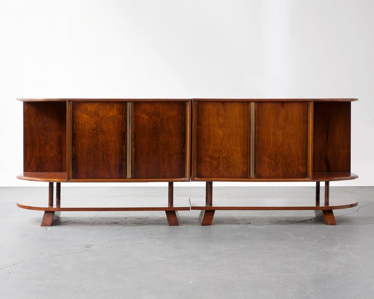 Two-piece credenza in jacaranda with four doors and curved sides. Designed by Joaquim Tenreiro, Brazil, 1950s.