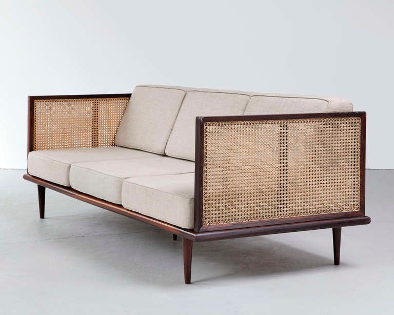 Sofa in jacaranda with cane sides and upholstered cushions. Designed by Martin Eisler for Forma, Brazil, 1950s. (Seat: 15