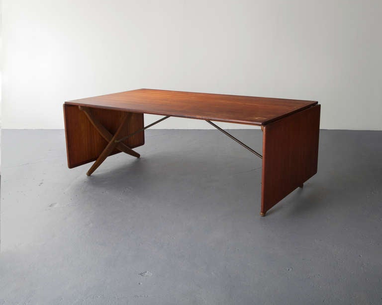 Large teak drop-leaf dining table. Designed by Hans Wegner, Denmark, 1958. This example was originally specified for a Greta Magnusson Grossman-designed residence, Los Angeles, 1958. (Length of the table with the leaves extended is 124