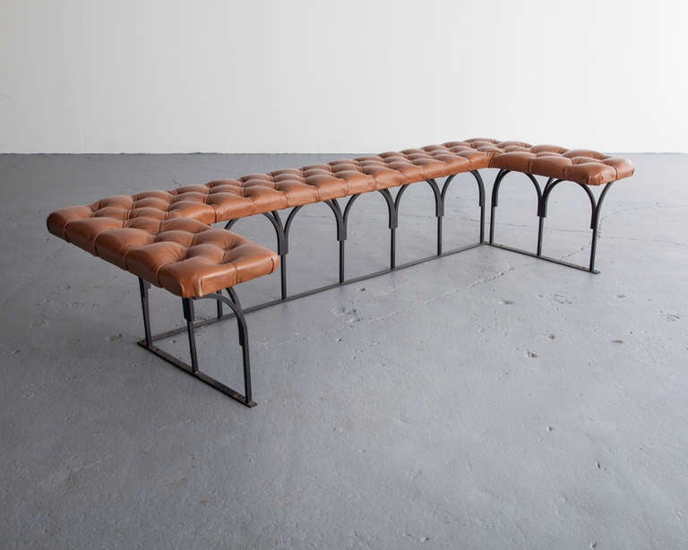 Unique fireplace bench in tufted leather upholstery on a steel frame. Designed by George Nelson as a custom piece for his own residence, 1950s.