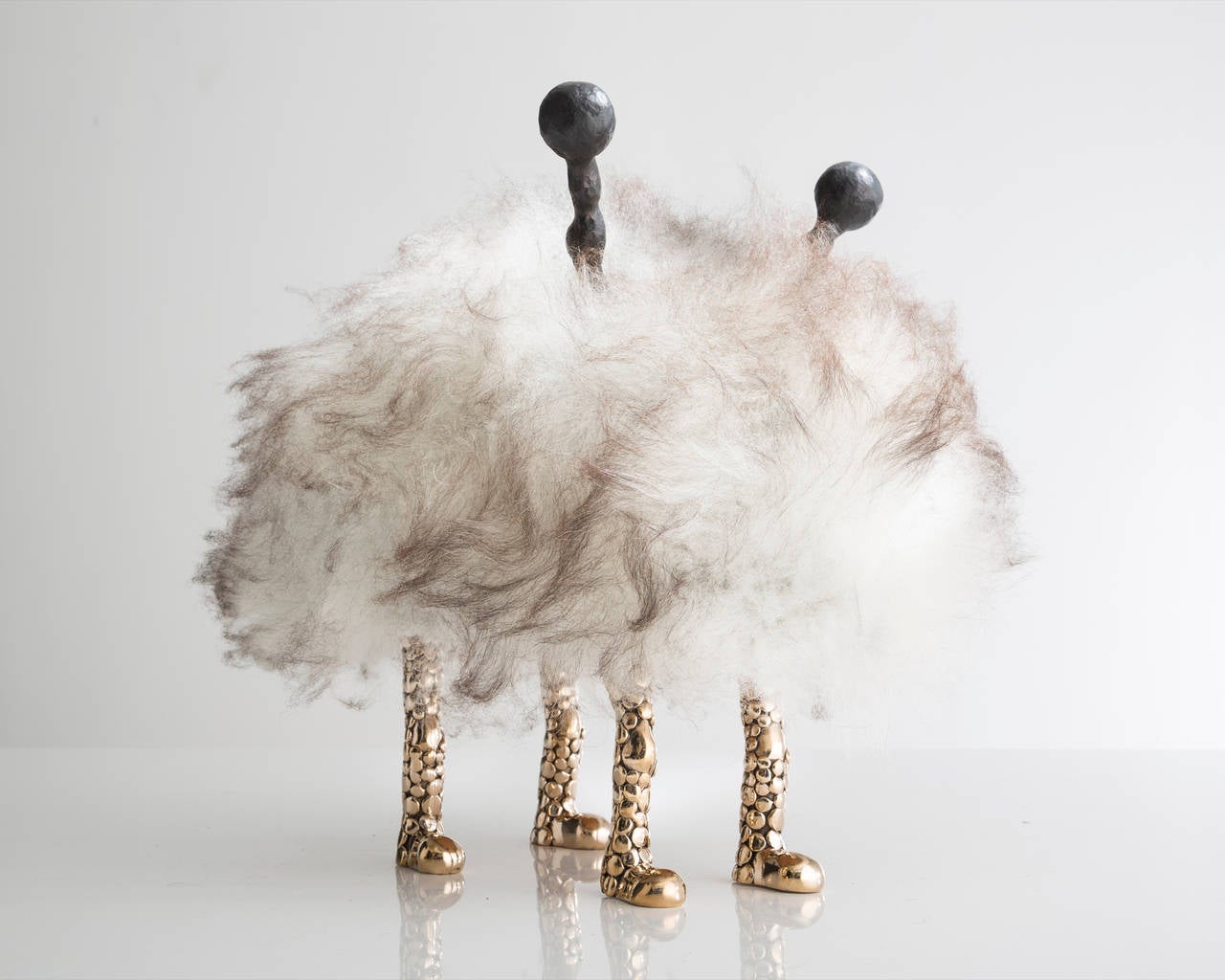 SM5191

Unique Duffy Mini Beast in gray Icelandic sheepskin with mini cheetah feet in bronze and carved ebony horns. Designed and made by the Haas Brothers, Los Angeles, CA, 2014.