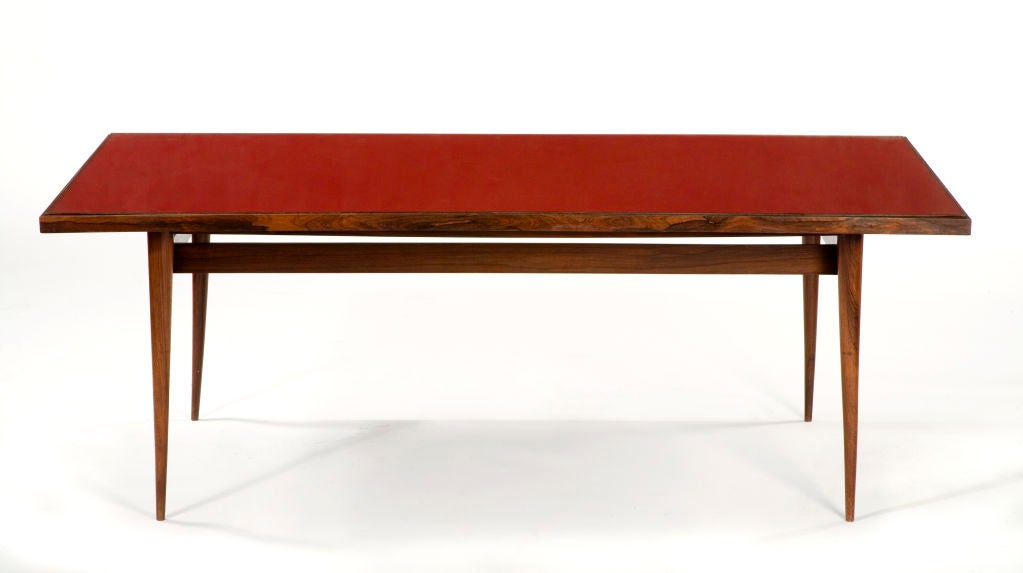 Dining table in jacaranda with red laminate and inset glass top. Designed by Joaquim Tenreiro, Brazil, 1948.