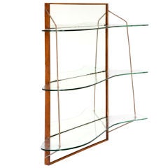 Wall-mounted shelving unit by Joaquim Tenreiro