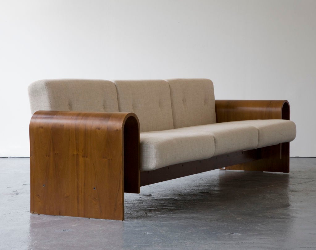 Three-seat sofa in imbuia wood. Created for the SESC hotel, 1990. Designed by Oscar Niemeyer, Brazil. Produced in Brazil, 2007.