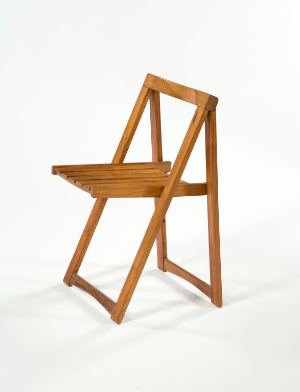 Set of 8 wooden folding chairs. Brazil, 1950s. (Seat height: 17.75