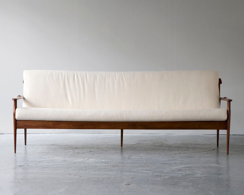 Sofa in jacaranda with upholstered seat and back cushions. Designed by Joaquim Tenreiro and produced by Tenreiro Móveis e Decorações, Brazil, circa 1960.