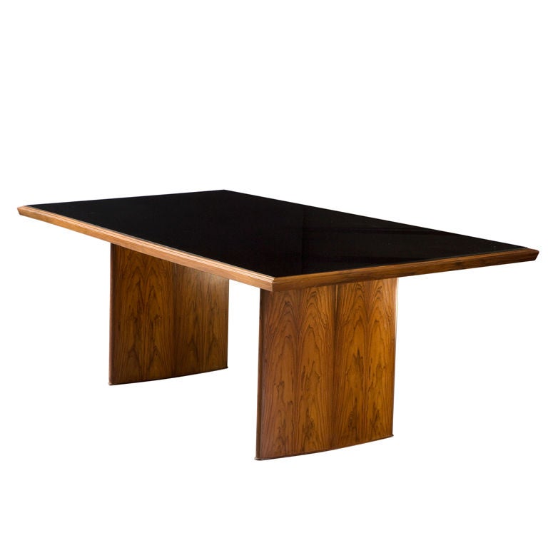 Rectangular dining table with frame in jacaranda and inset black underpainted glass top. Designed by Joaquim Tenreiro, Brazil, 1949.