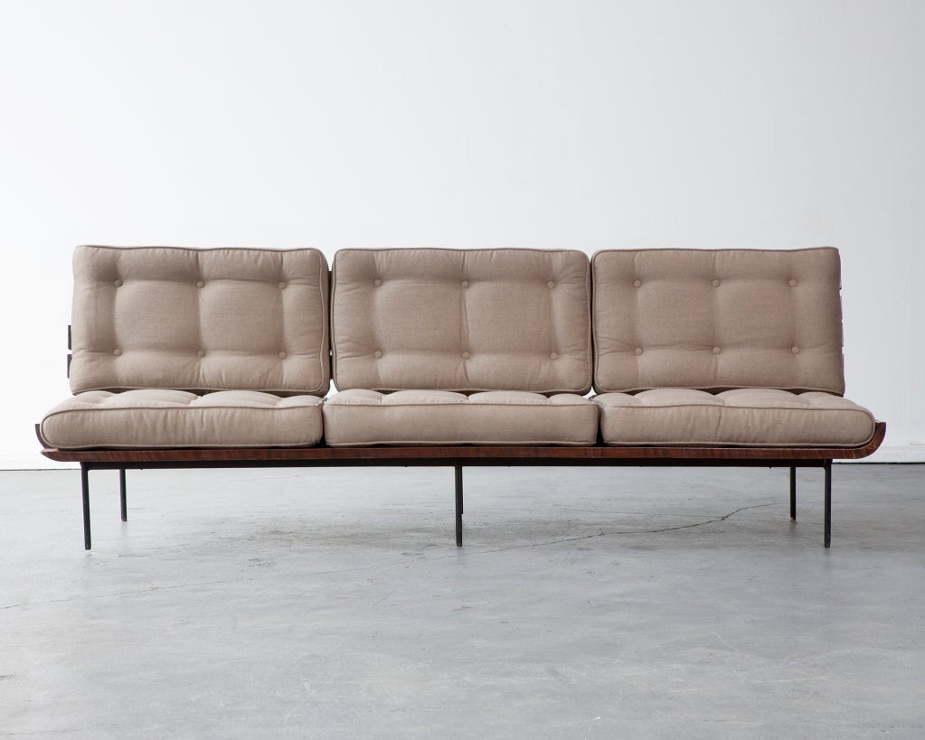 Sofa with horizontal back slats in jacaranda and upholstered cushions. Designed by Joaquim Tenreiro, Brazil, 1950s.