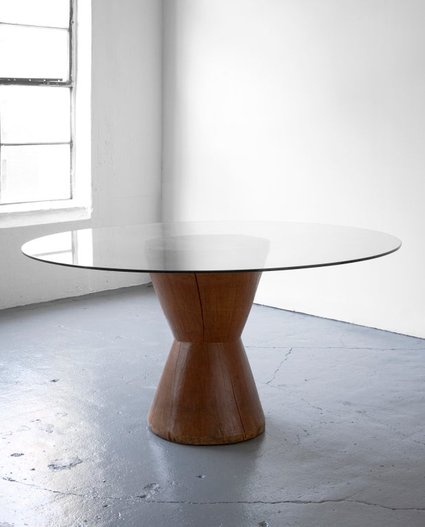 Round dining table in solid wood with glass top. Designed by Jose Zanine, Brazil, circa 1970.