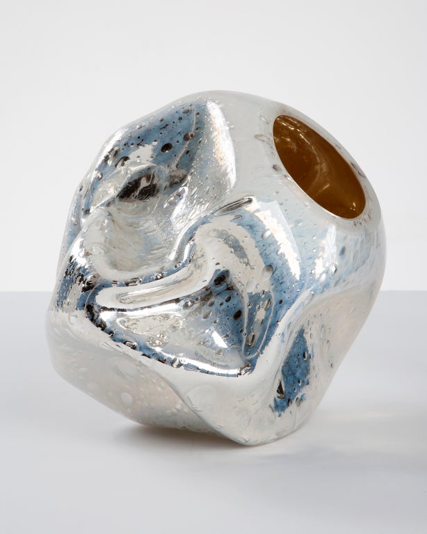 Unique crinkled sculptural vessel in silver mirrorized baking-soda hand-blown glass. Designed and made by Jeff Zimmerman, USA, 2012.