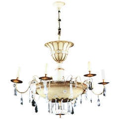 A French parcel-gilt and white-painted six-light chandelier by Maison Baguès