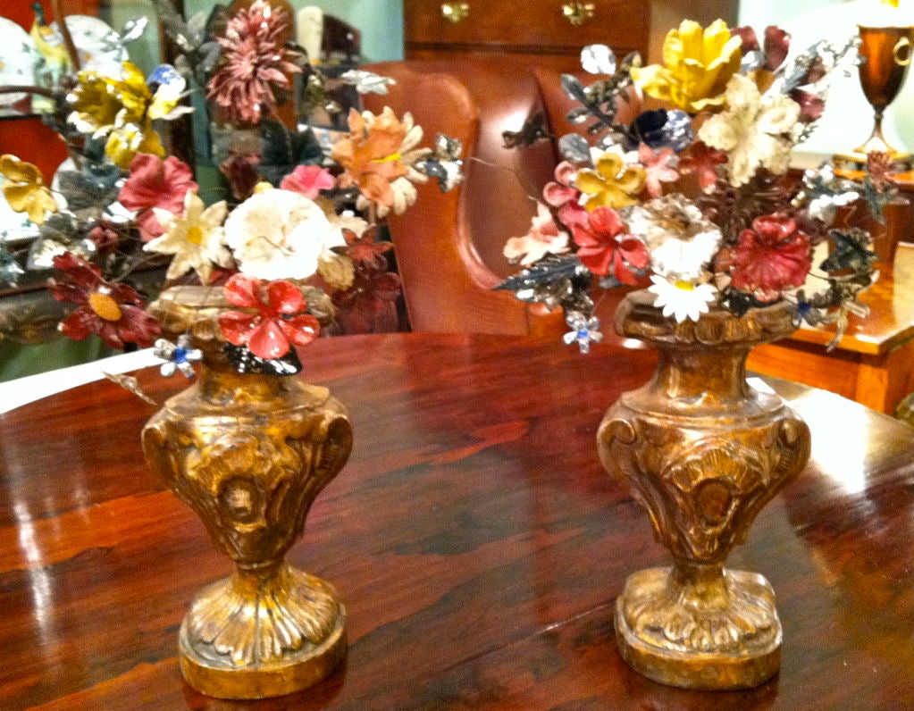 19th century French painted tole flowers in giltwood bases.