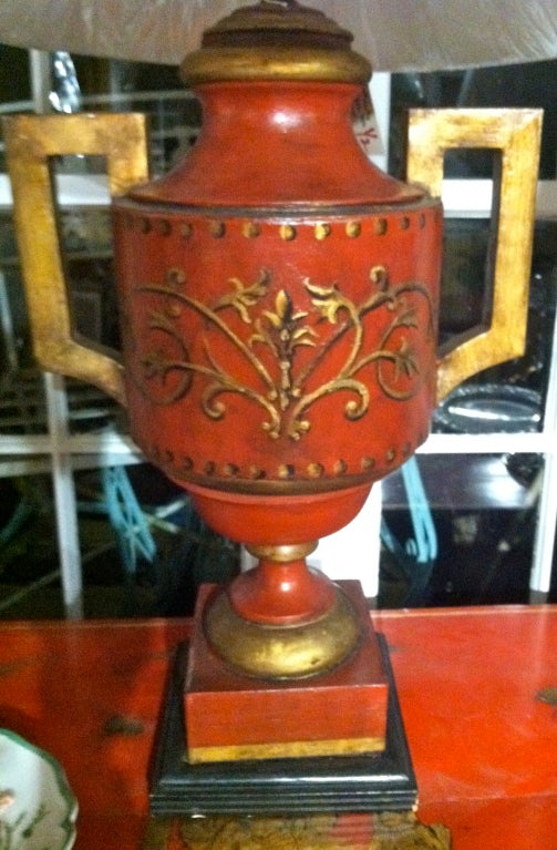 19th century English red tole painted with gold design urn as a lamp.