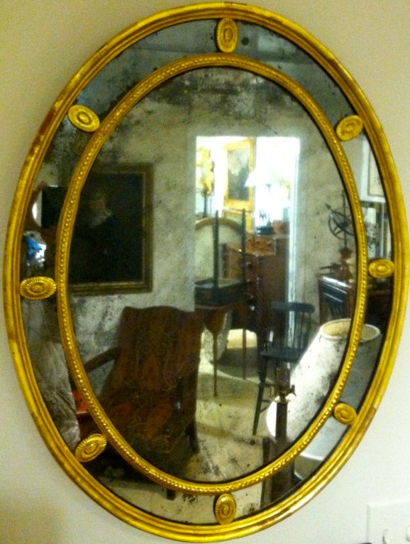 English 19th century oval Regency mirror.