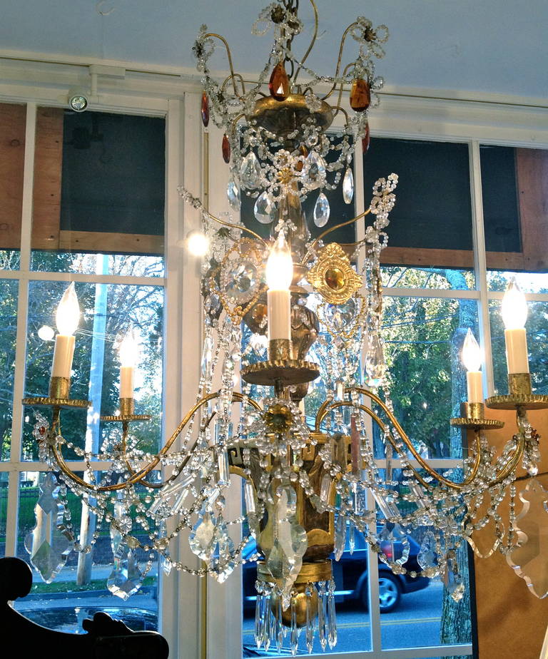 European 19th century gilt and painted wooden and crystal chandelier.