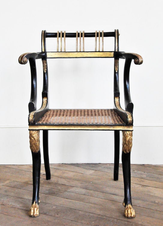 A Single Black & Gilt Regency Armchair