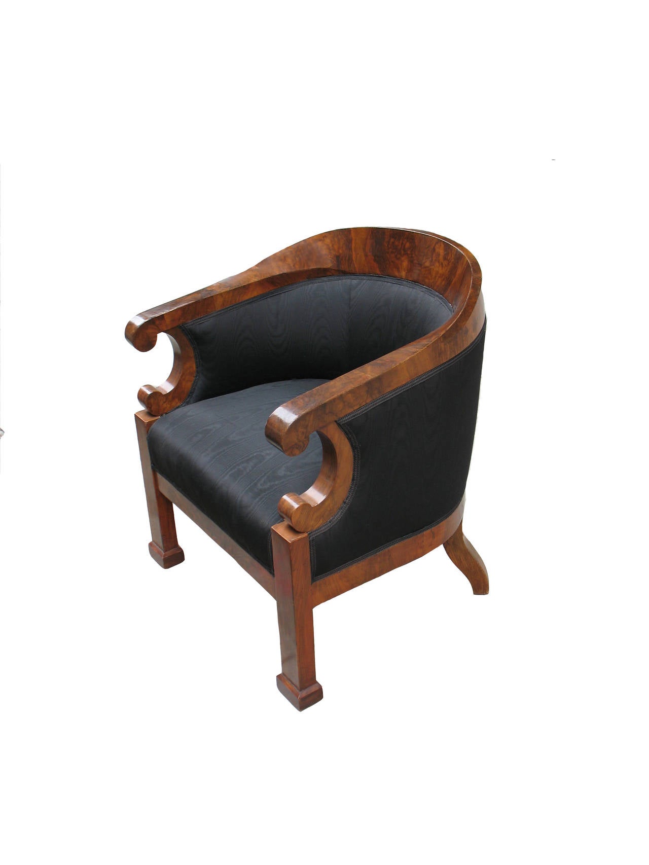 This pair of highly comfortable Biedermeier barrel back bergeres from the 1820's is exemplary for the popular Viennese barrel back design from the 1820's. Walnut standing root-head with exceptional grain configuration. Veneered on pine wood.