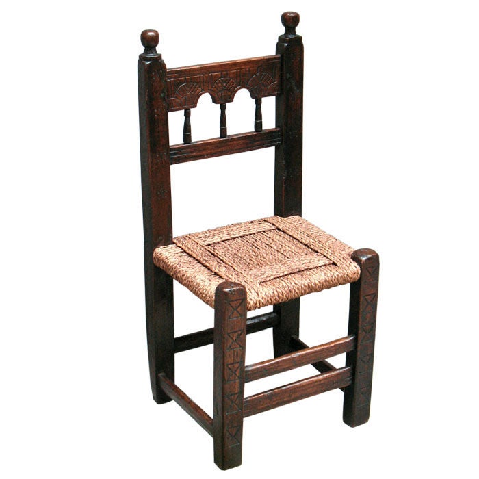 Four Moorish-Spanish post chairs for Connoisseurs and collectors of earliest available authentic furniture. From a monastery on the Balearic Islands. Solid walnut with indent carvings on front posts, shoulder boards and stretchers. Original