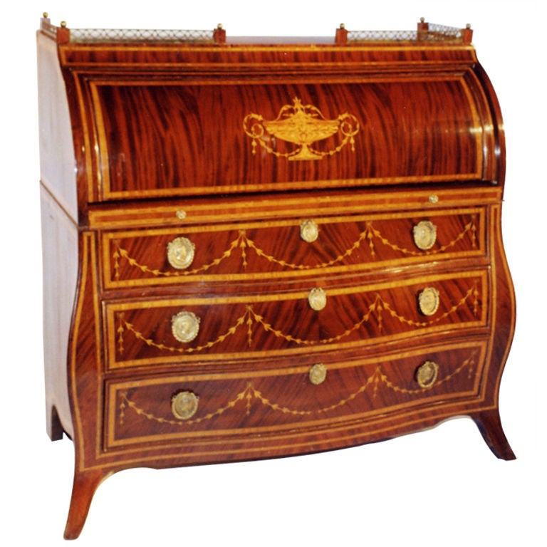 This unequaled Dutch Neo-Classical decorated roll top-desk with Bombe-shaped body in the Rococo tradition is veneered with mahogany on oak. Plentifully inlaid with Louis XVI motifs (urn, garlands, fillets, hairlines) in maple and ebony. Pierced