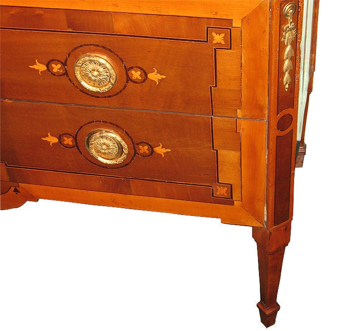 Rare Swiss Louis XVI chest with a two-drawer body (sans traverse) with marble top, canted corners and long tapered legs. Veneered with walnut and maple on pine. Inlaid with mahogany and maple. Original bronze ormolu mounts, locks and marble top.