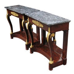 Matching pair of magnificent Empire console tables