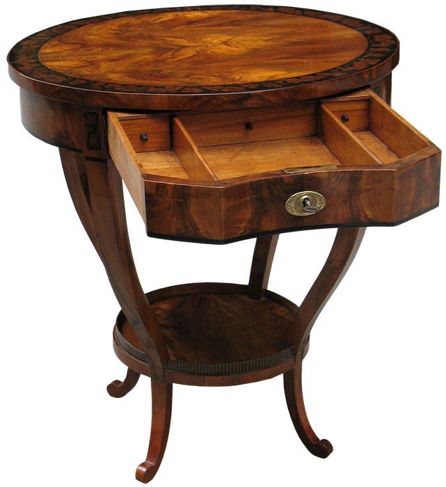 Unequally detailed Austrian Biedermeier side table in bookmatch walnut on pine. Table top with magnificent penwork border. Lower apron, necks of legs and platform, as well as lower balustrade, all with penworks. Drawer with rare concave front. Three