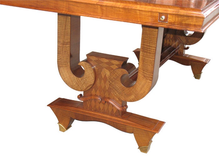 Oversized French Art Deco dining or conference table with finest detailing. Original Rosewood and East Indian palisander book match and cross-grain veneered. Hairline inlaid with sycamore. Scrolled supports, parquetry panels, moldings, legs with