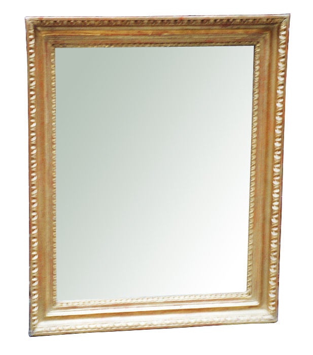 Exemplary Austrian Biedermeier gilt wood frame with egg & dart molding and stiff leaf border framing the mirror plate. Original gilding in the rare combination of oil gilded and (more shiny) water gilded parts. 

References are included in our