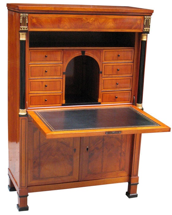 Biedermeier secretaire in cherry wood on oak. 
Fall front, frieze drawer and book match veneered doors all paneled with hair lines. 
Greek key details. 
Ebonized columns with gold leaf trim. 
Bronze ormolu mounts. Magnificently detailed marquetry