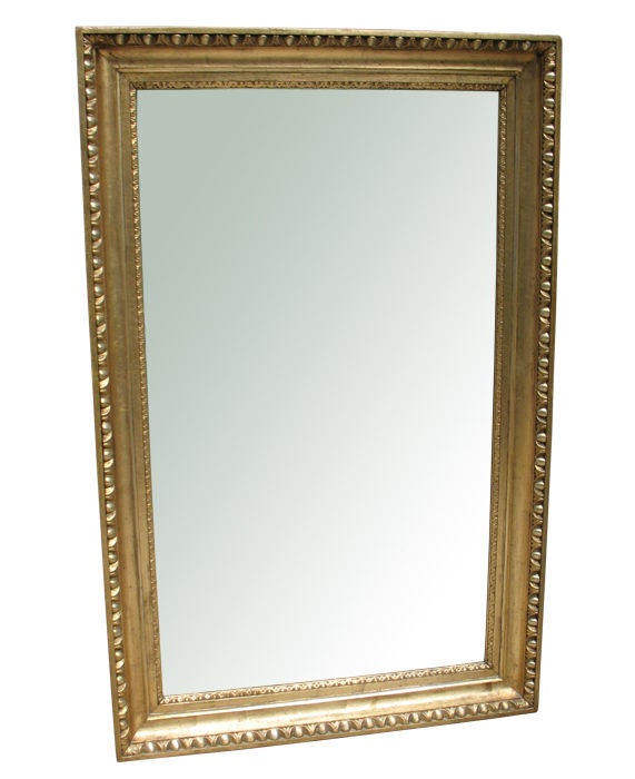 Exemplary Austrian Biederemier frame with "egg & dart" molding and fine detailed "stiff leaf" border surrounding the mirror plate.
Original gilding and original back wall. Rare combination of oil gilding with (more shiny)