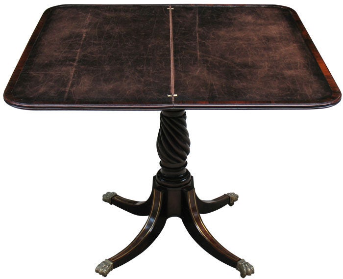 Outstandingly designed and detailed Russian flip-over card table, usable as console table as well. Matching veneered with mahogany on oak. Unique spiral centre pedestal. Table-top and four splayed legs inlaid with brass fillets. Apron with brass