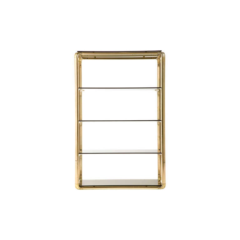 vintage etagere. smoked glass shelves. brass frame.