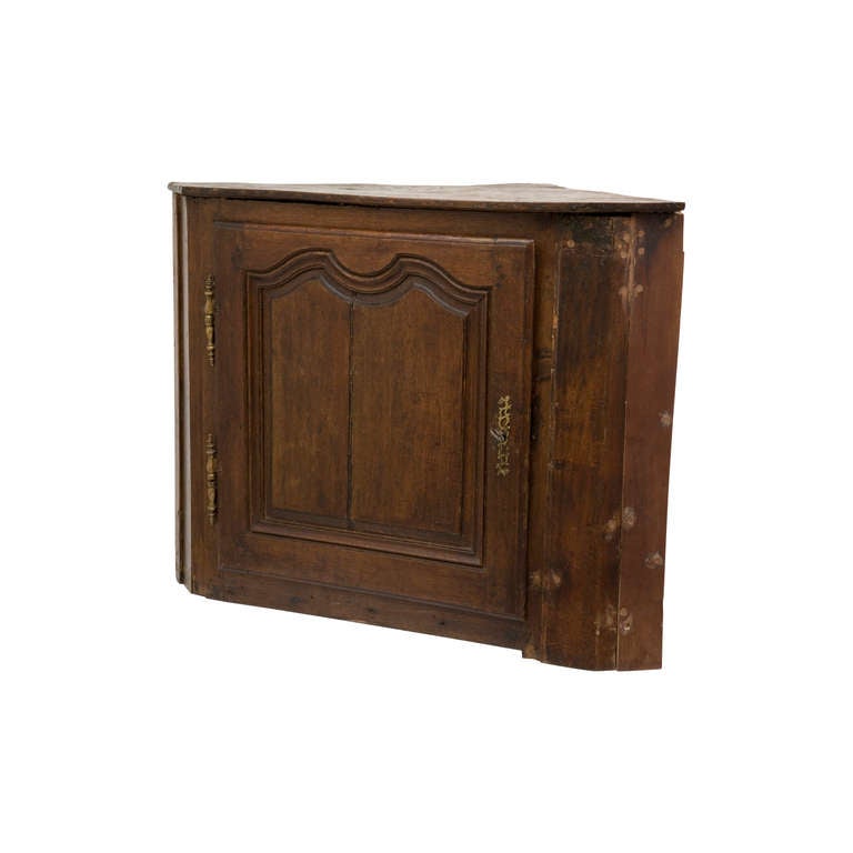 antique corner cabinet. brass hardware.