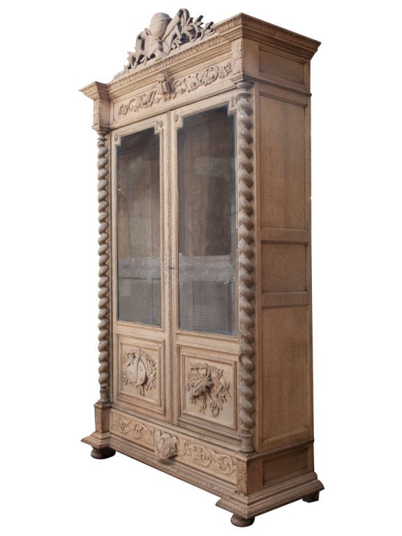 Beautiful armoire with incredible detail and grand scale. Glass doors with wooden feet.