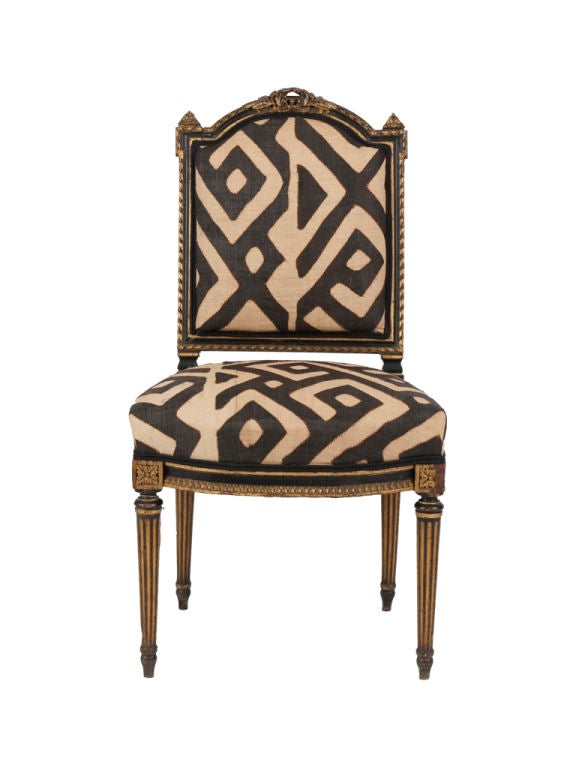 Original frame with gilt details. Reupholstered in African kuba cloth. Set of two available. (priced individually).