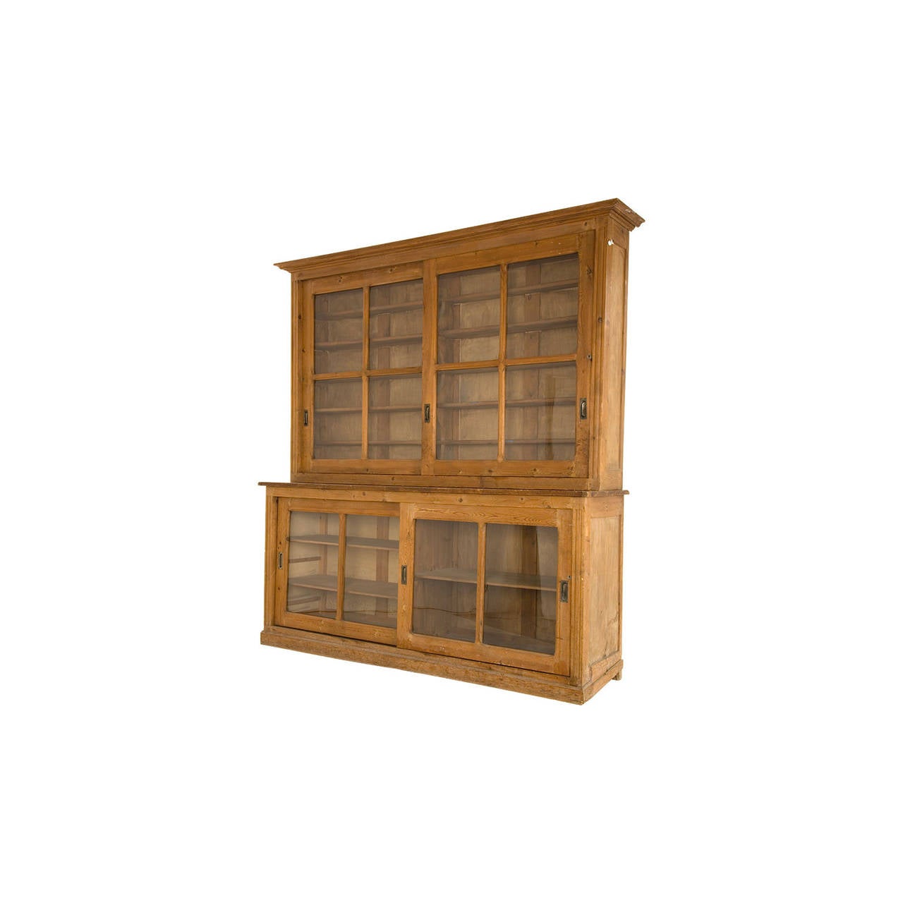 antique breakfront. salvaged from a french laboratory. glass pane sliding doors. oak. brass details.