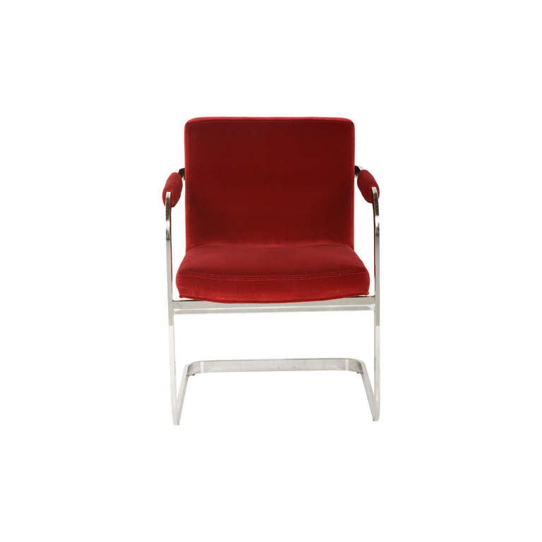 vintage armchair. reupholstered in crimson velvet. chrome frame.