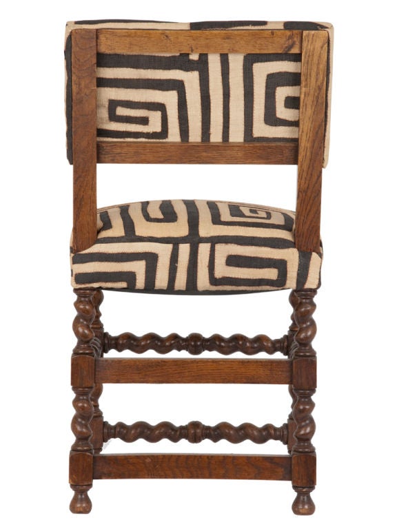 Lovely vintage chair. Reupholstered in african kuba cloth. Pair available (priced individually).