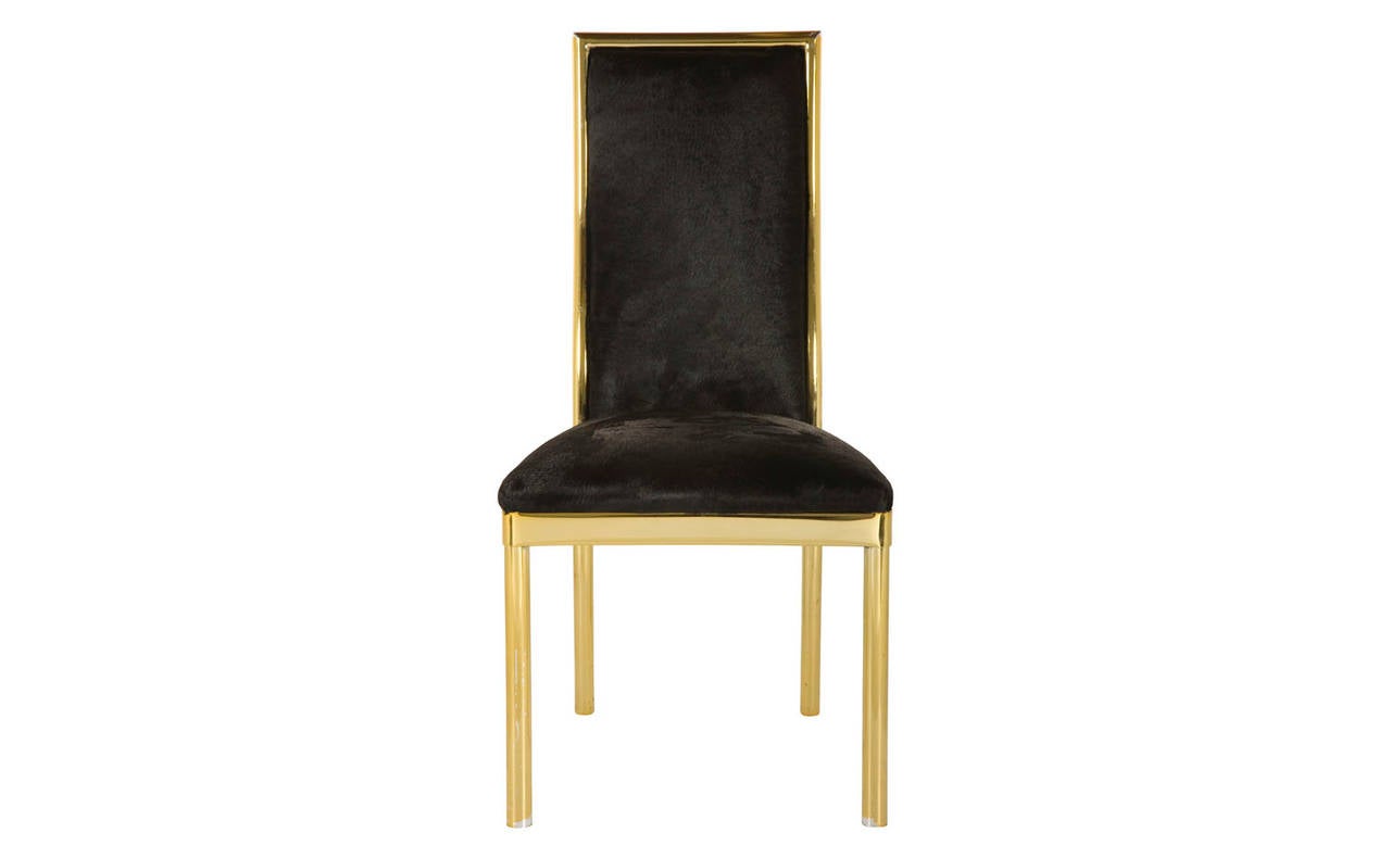 Vintage dining chair. Reupholstered in black cowhide. Brass frame. Pair available (priced individually).