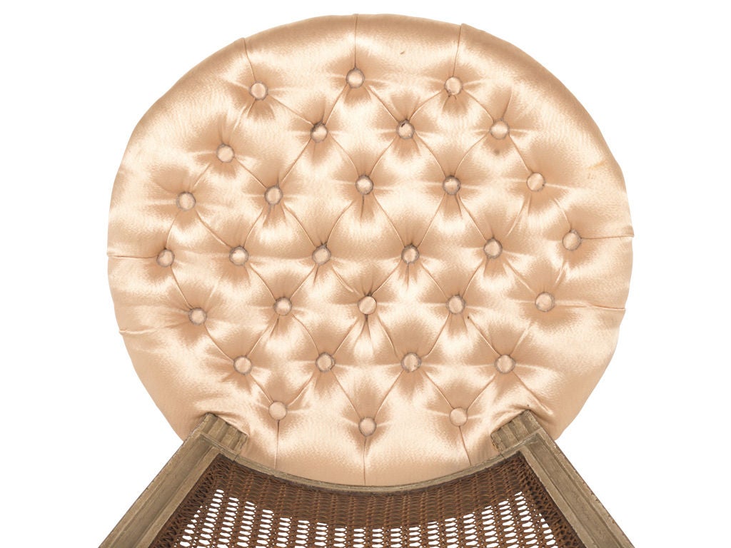 antique louis XVI chair. tufted silk upholstery as found. antique brass nailheads. original cane back.