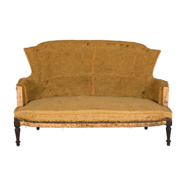 antique settee. unupholstered frame as found.