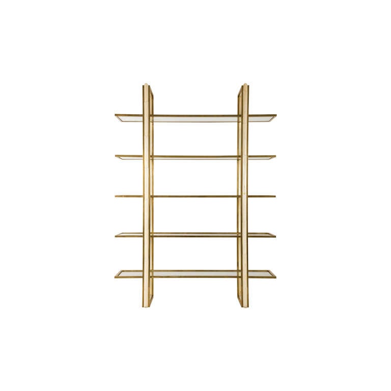 vintage etagere. brass and wood frame. glass shelves.
