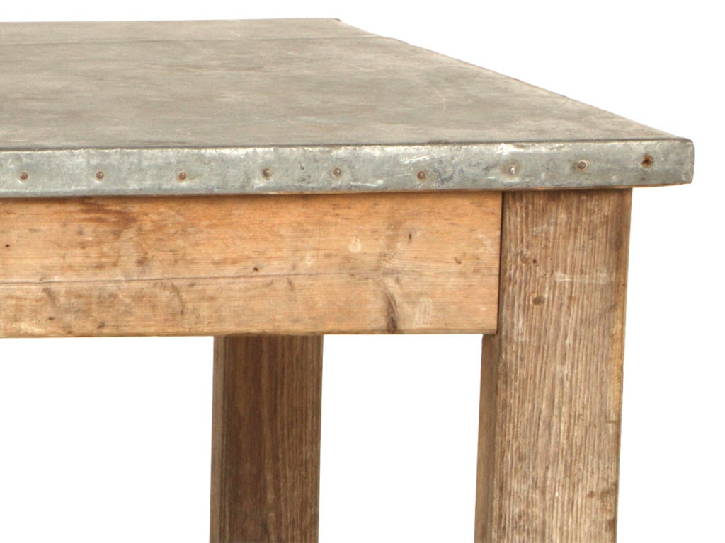 Antique work table. Original zinc top. Weathered wood base.