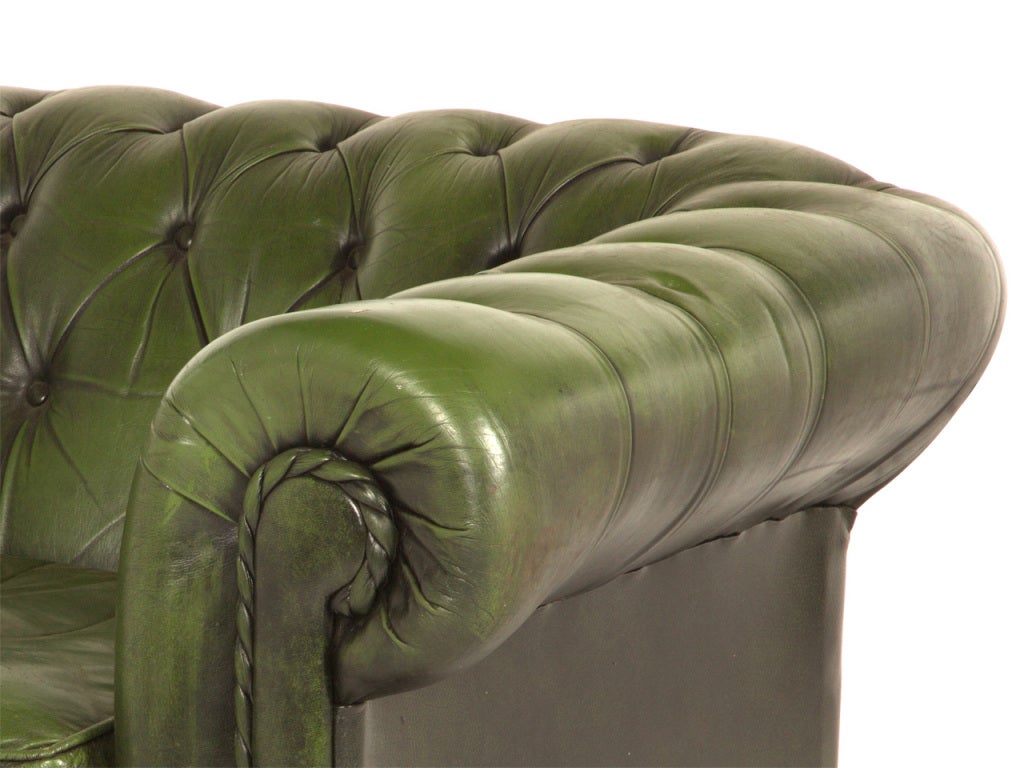 Vintage green leather chair. Lovely patinaed leather.