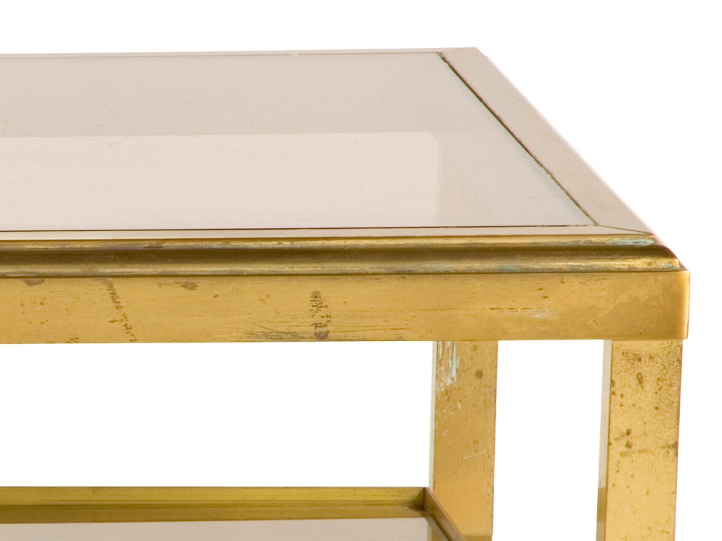vintage coffee table. smoked glass top. gilt foil bottom glass shelf.