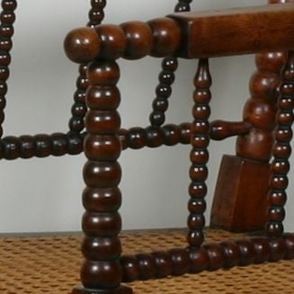 A 19th century grained beech bobbin chair