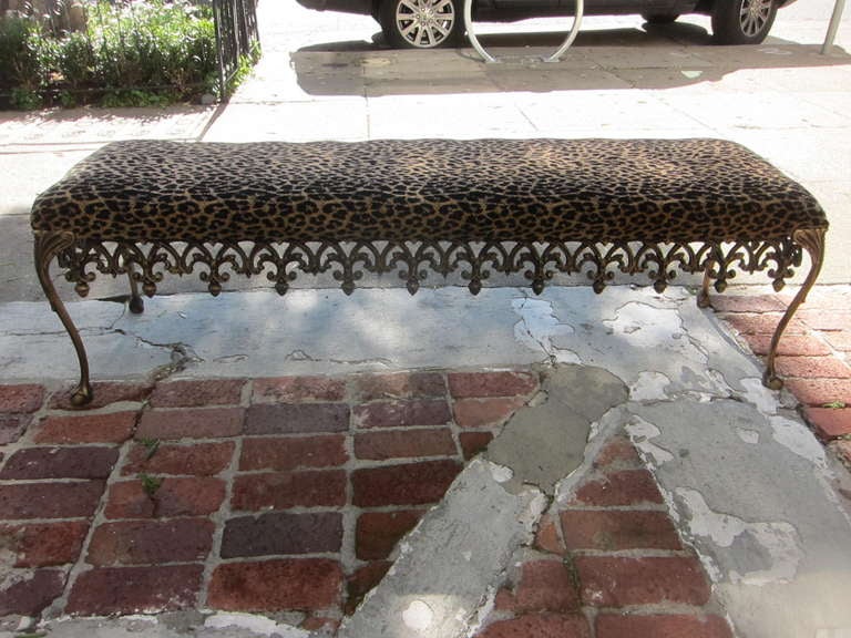 Beautiful Hollywood Regency bench. Elaborate metal frame (thick and solid).  Antiqued gold leopard print bench. Sexy bench! 

Length: 60