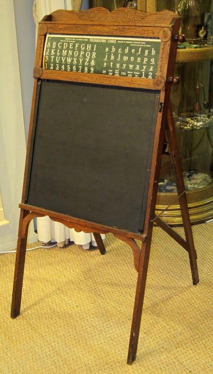 This is a fantastic portable easel desk. It is very light to move about. It has a blackboard that opens to a desk. Inside are compartments for storage of school items secured by rope to prevent them from falling out. The wood is carved and there is