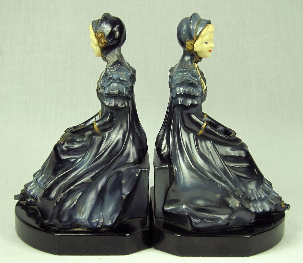 Featured is a beautiful set of bookends produced by the J.B. Hirsch Foundry circa the 1930s . The composition is of painted spelter (