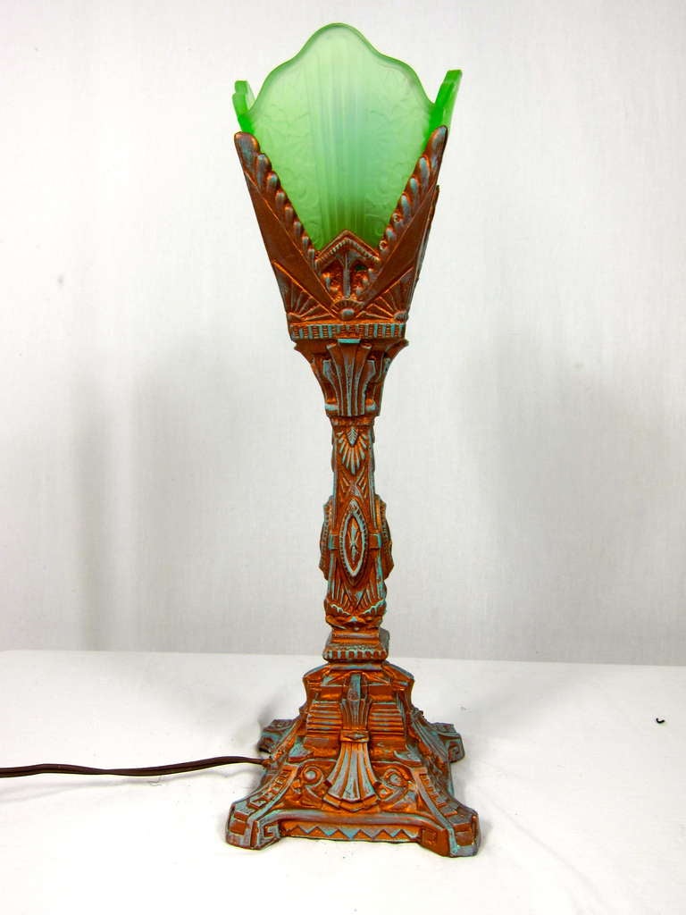 This is a great lamp from the 1920-1930's ART DECO period.
It has textured green glas and brass patina base. The lamp appears to have been re-wired. The bottom is missing it's full felt. Lovely piece! 

16